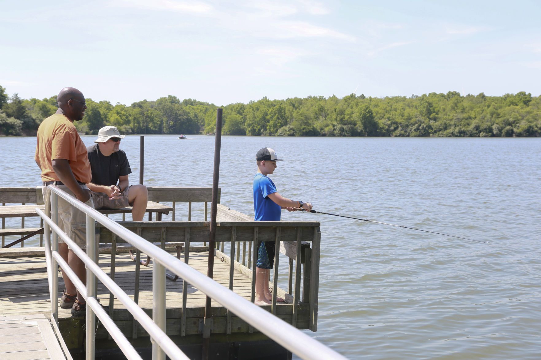 Van Grissom, Gerard Gabbard watch as Seth Gabbard fishes